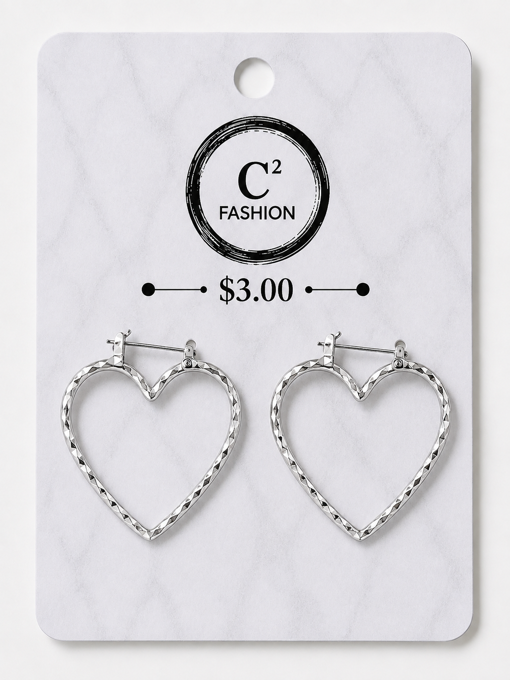 A pair of silver heart-shaped hoop earrings displayed on a white marble-patterned retail card. The card features the brand name 'C2 FASHION' and a price of '$3.