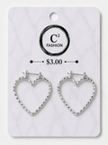 A pair of silver heart-shaped hoop earrings displayed on a white marble-patterned retail card. The card features the brand name 'C2 FASHION' and a price of '$3.