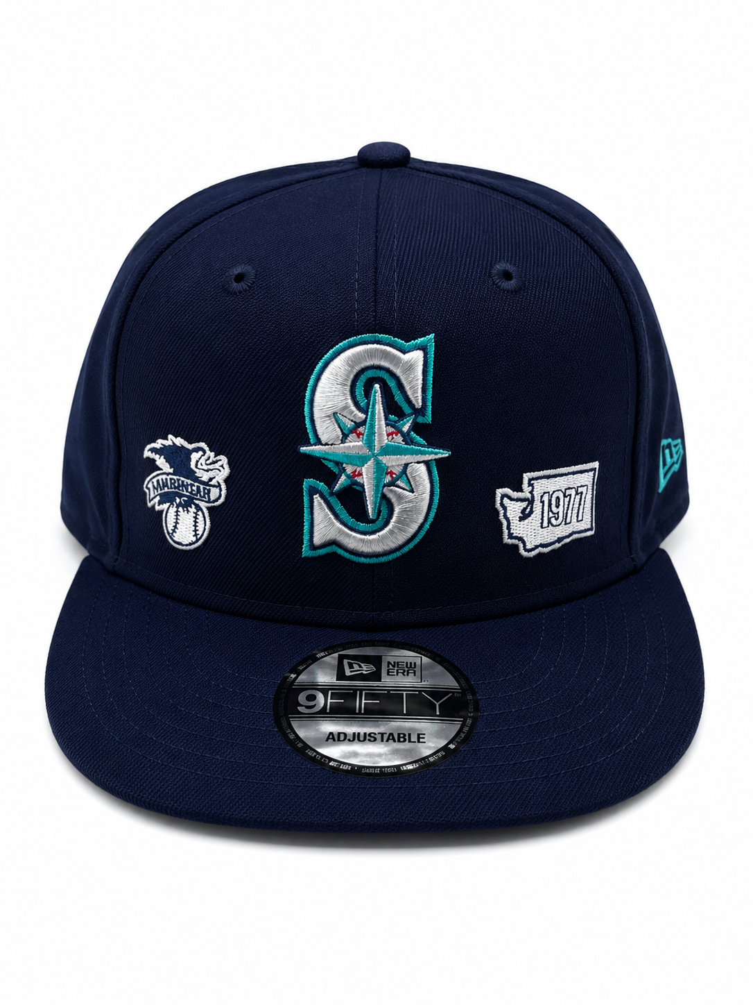 Navy Mariners snapback with front compass 'S' logo, American League patch, and 1977 anniversary embroidery.