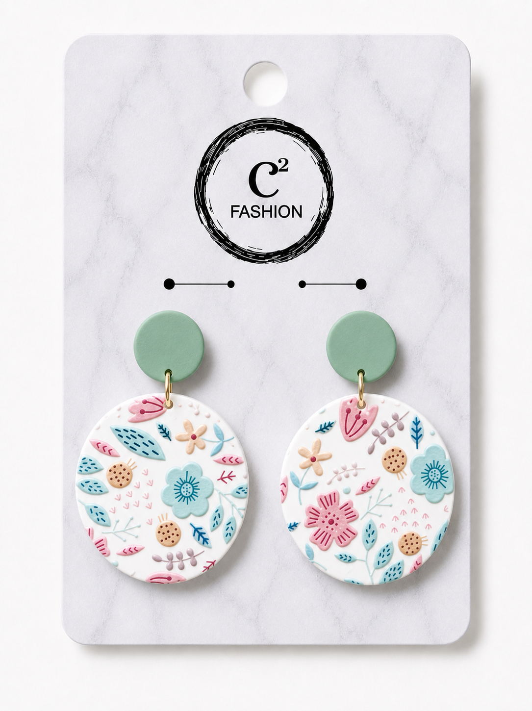 “Mint green floral statement earrings with colorful pink, blue, and peach flower details on a white round drop, displayed on a C2 Fashion jewelry card.”