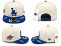 Cream crown with royal blue visor, classic LA logo, 1988 World Series side patch, and premium fitted construction.