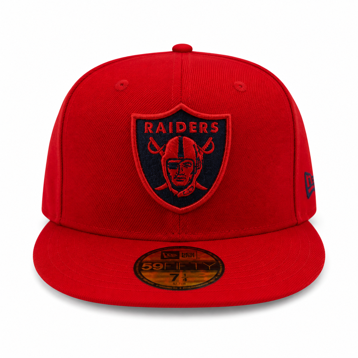 Red cap with a black logo featuring a face and 'RAIDERS' text on a white background