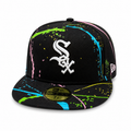 Black New Era 59FIFTY fitted Chicago White Sox cap with white “Sox” logo and multicolor paint splatter design, flat brim, size 7 1/4, displayed on a clean white background.