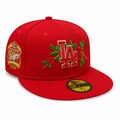 Red New Era 59FIFTY fitted LA cap with raised “LA” logo, floral embroidery around the logo, World Series Champions side patch, flat brim, size 7 1/8, displayed on a clean white background.