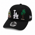 Black New Era 9FORTY adjustable snapback cap with white “LA” logo, palm tree embroidery, Dodgers side patch, curved brim, displayed on a clean white background.
