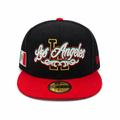 Black fitted cap with red brim, Los Angeles script embroidery, LA logo detail, Mexican flag side patch, and 59FIFTY sticker on a clean white background