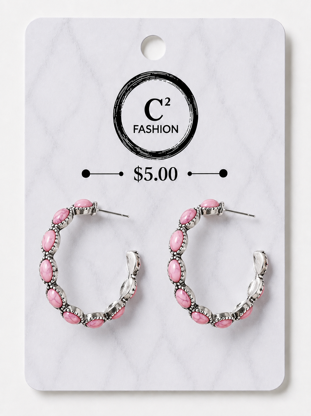 A pair of silver-tone hoop earrings with pink oval rhinestones, displayed on a white marble-patterned retail card with the brand name C² FASHION and a $5.00 price printed on it.