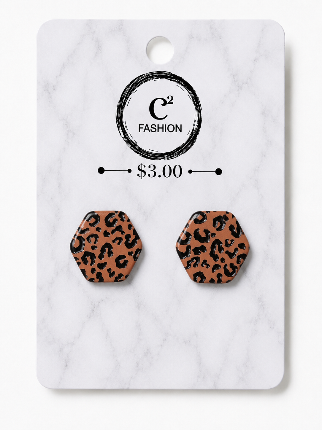 A pair of hexagonal stud earrings with a brown and black leopard print pattern, mounted on a white marble backing card featuring the brand logo 'C2 FASHION' and a price of '$3.00'.