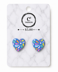 A pair of heart-shaped stud earrings with a colorful abstract pattern on a white marble display card. The card features the brand logo 'C2 FASHION' and a price of '$5.