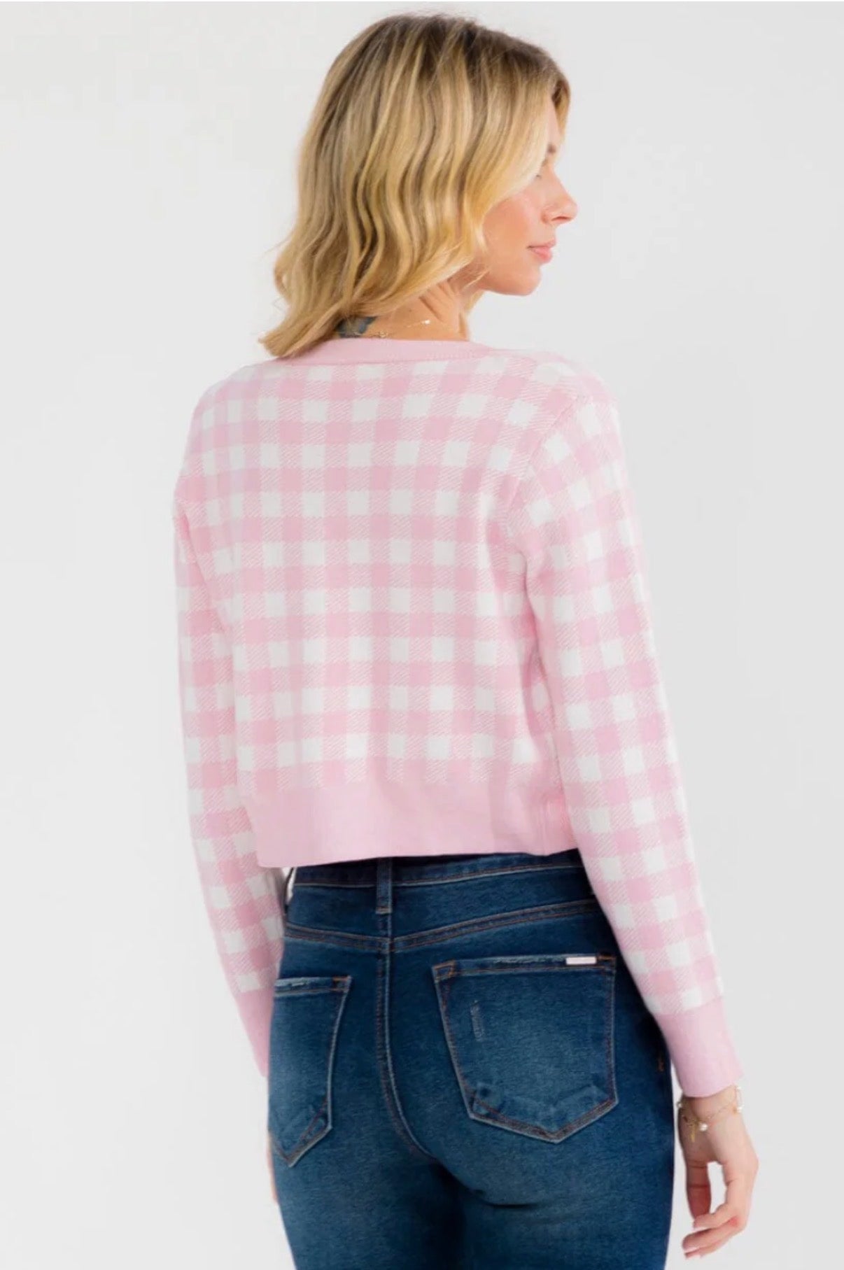 Two-piece set featuring a fitted crop tank paired with a structured button-up cardigan.