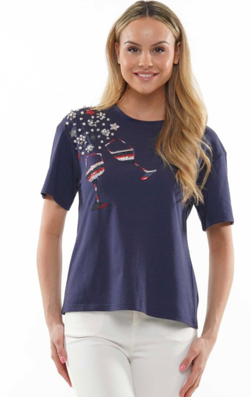 Girl wearing blue sequin glasses tee.
