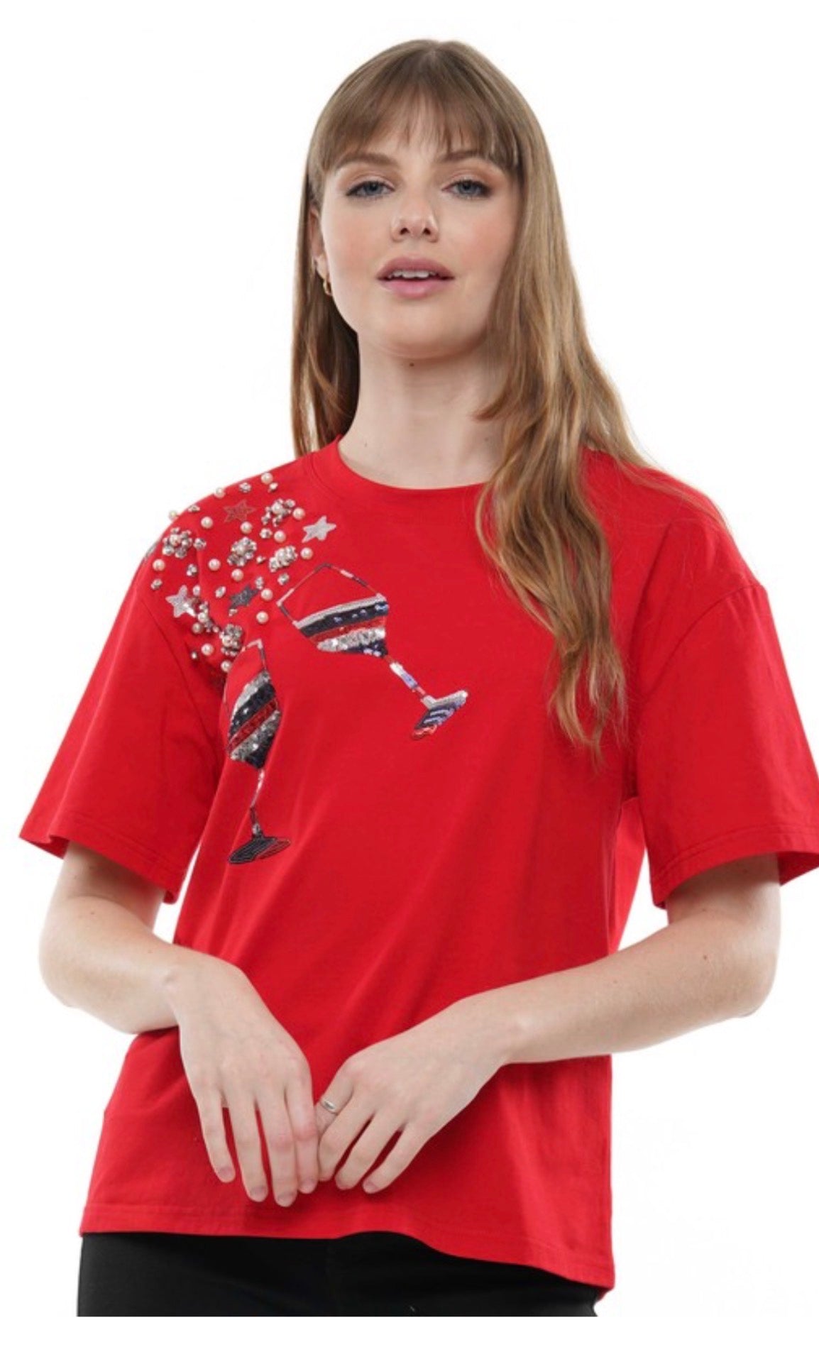 Girl wearing red sequin glasses tee.