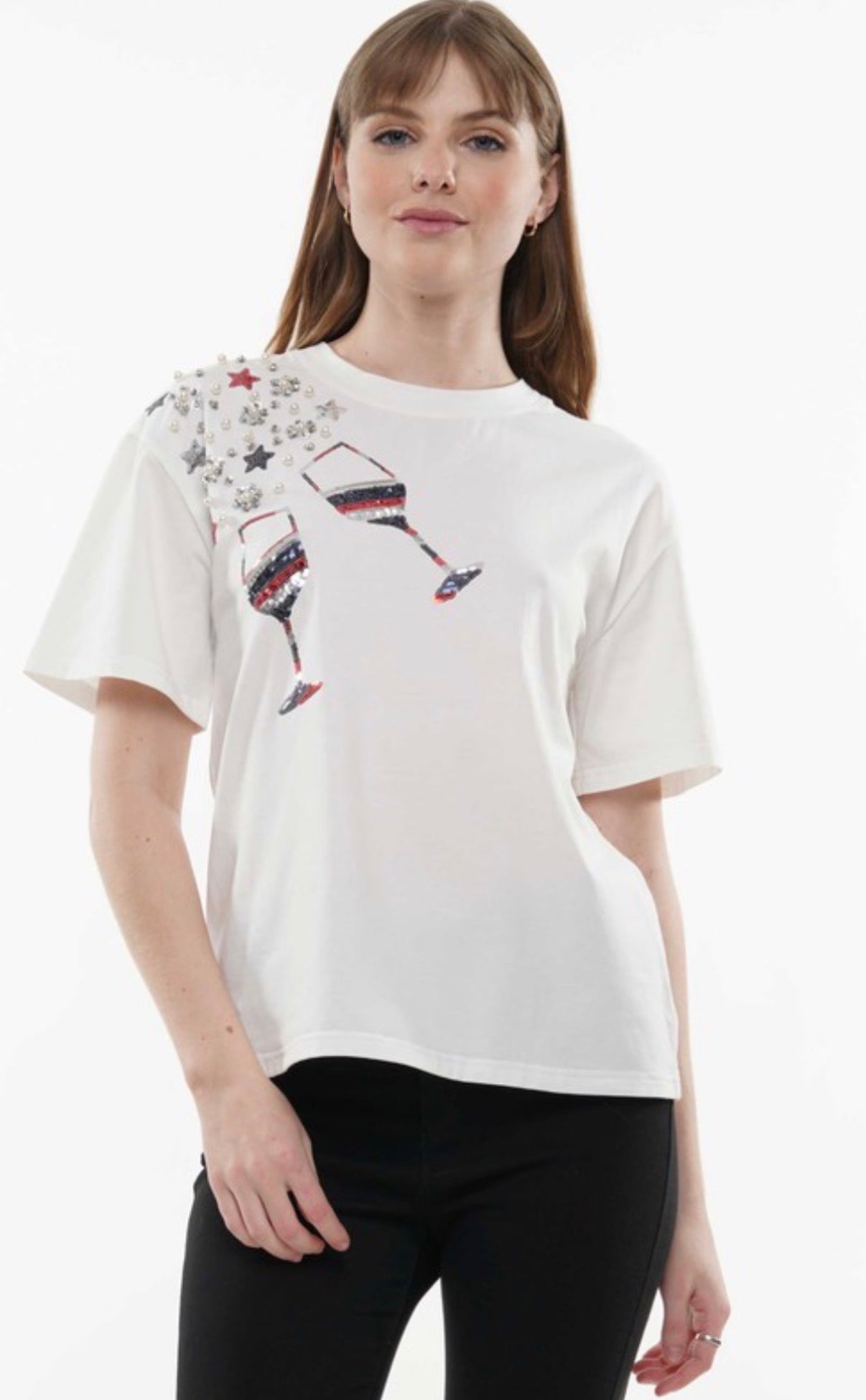 Girl wearing white sequin glasses tee.
