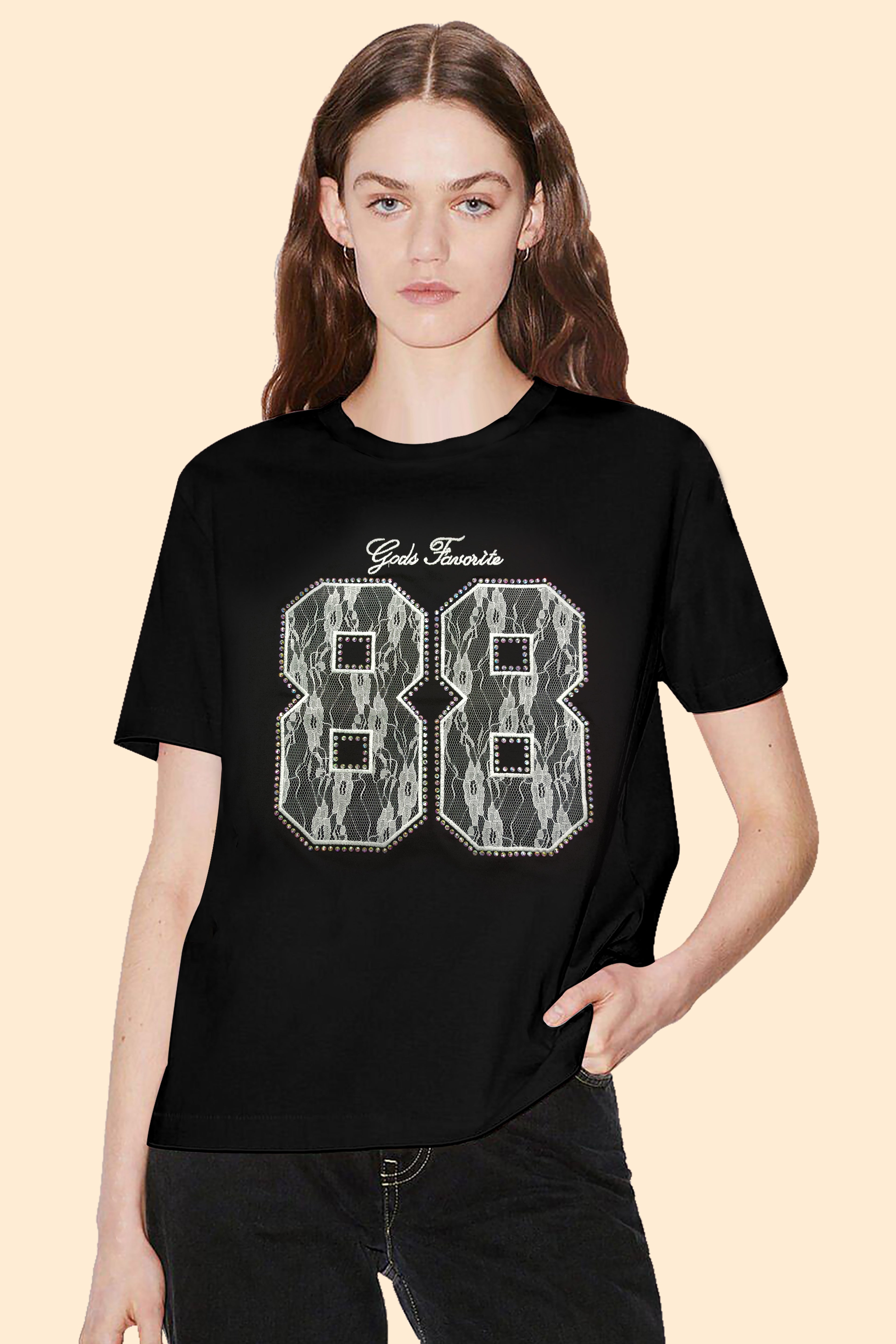 Person wearing a black t-shirt with lace details on the number 88 against a beige background