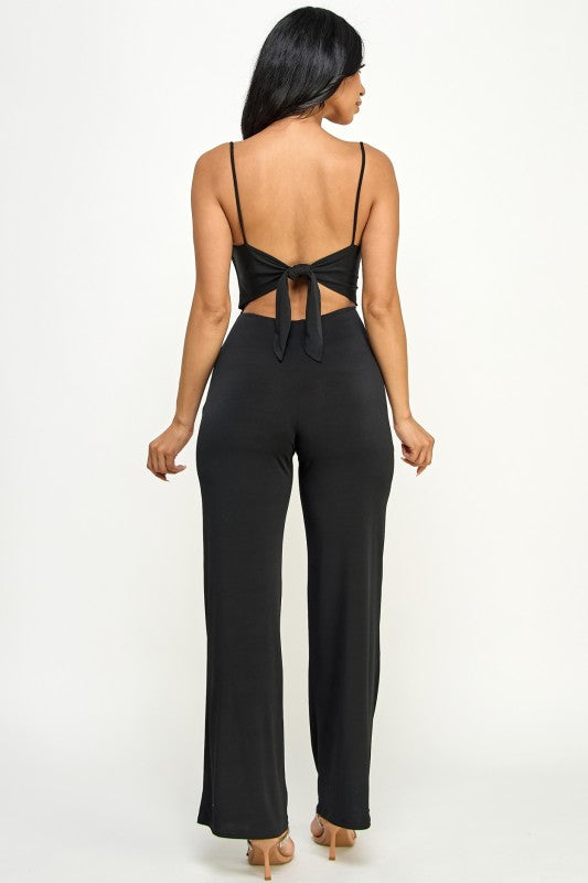 Black jumpsuit with open back on a white background