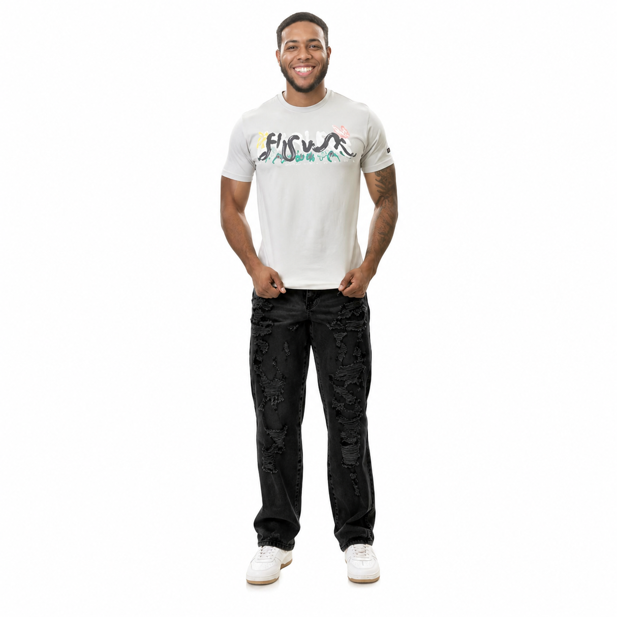 Man wearing a white t-shirt with a logo and black pants on a white background