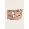 A light beige faux leather belt with a silver-tone metal buckle, neatly coiled on a light cream background.