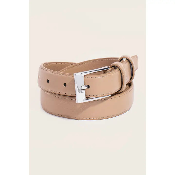A light beige faux leather belt with a silver-tone metal buckle, neatly coiled on a light cream background.