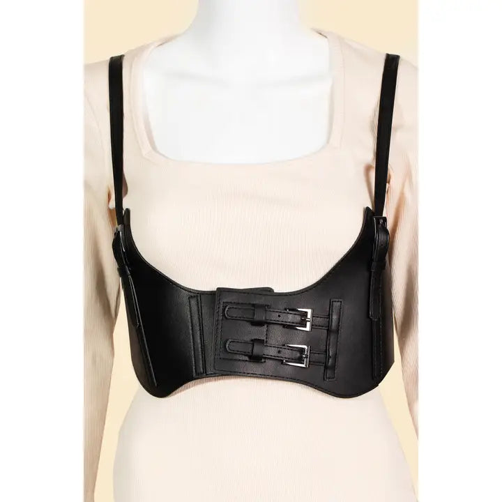 Black leather harness on a mannequin with a beige background